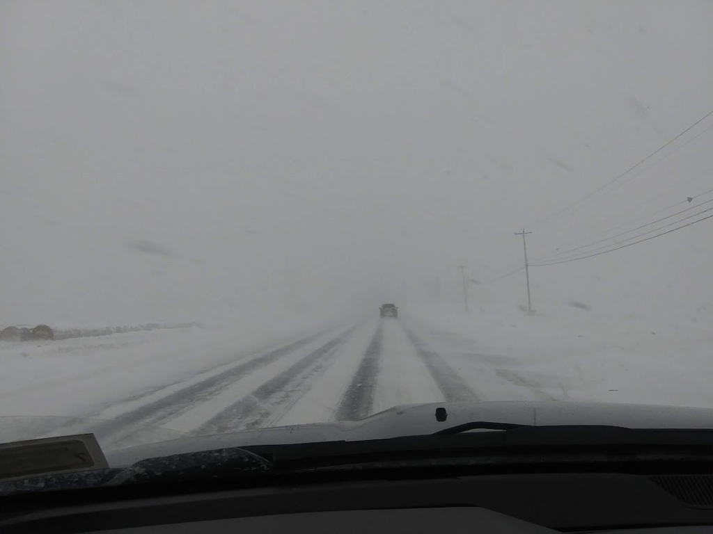 Whiteout driving conditions on a North Country road during lake-effect snow
