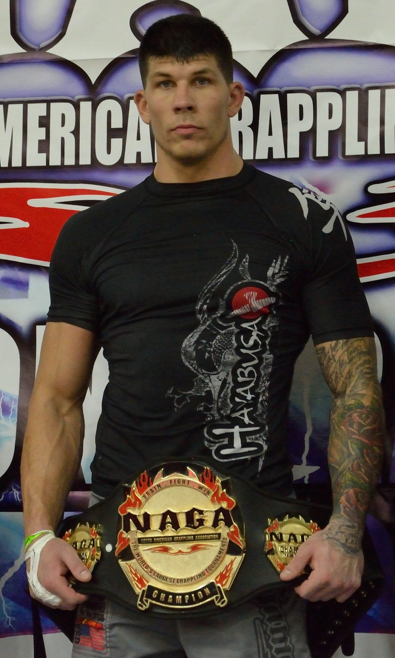Dustin Baker holding the NAGA championship belt, Boston 2016